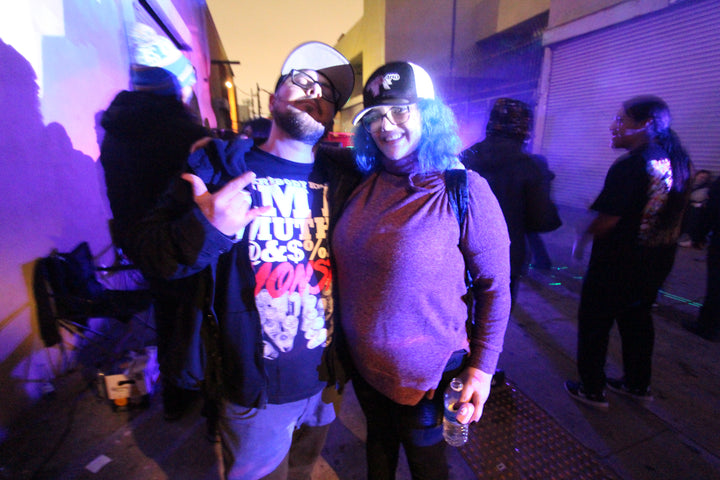 Two partygoers posing in a downtown LA alley at Love Yourself, February 2024