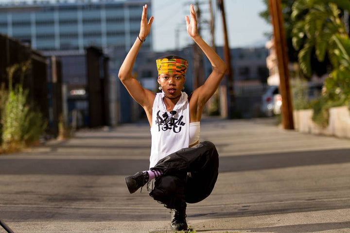Popper Angyil hitting a pose on a downtown street