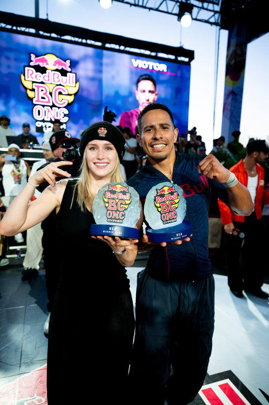 Red Bull BC One Cypher USA 2026 champions B-Girl Blondie and B-Boy Victor holding their winner trophies in San Diego