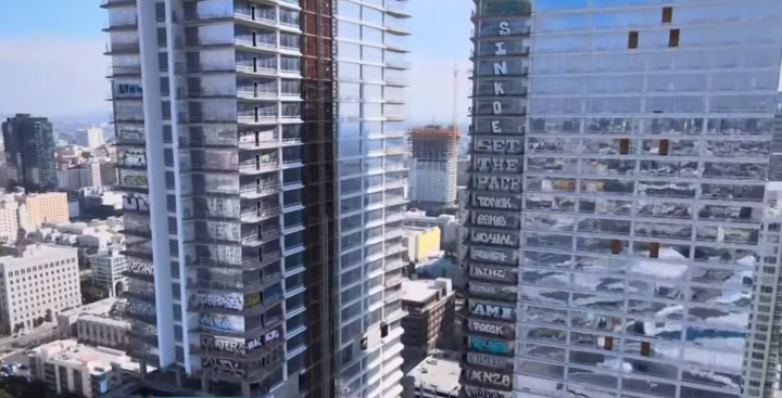 Oceanwide Plaza towers in downtown LA with graffiti on the upper floors