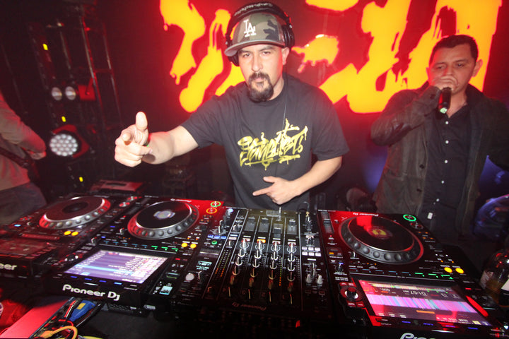DJ pointing at the crowd with an MC beside him at Bass Realm's Upgrade, Alhambra, March 2024