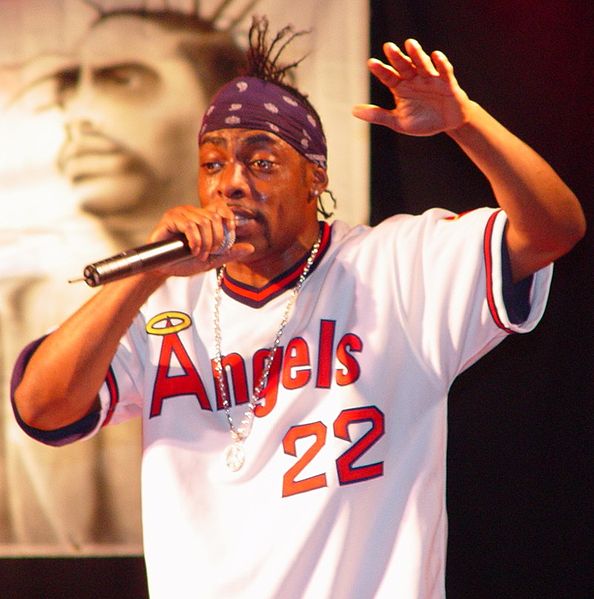 Coolio performing on stage in an Angels #22 jersey