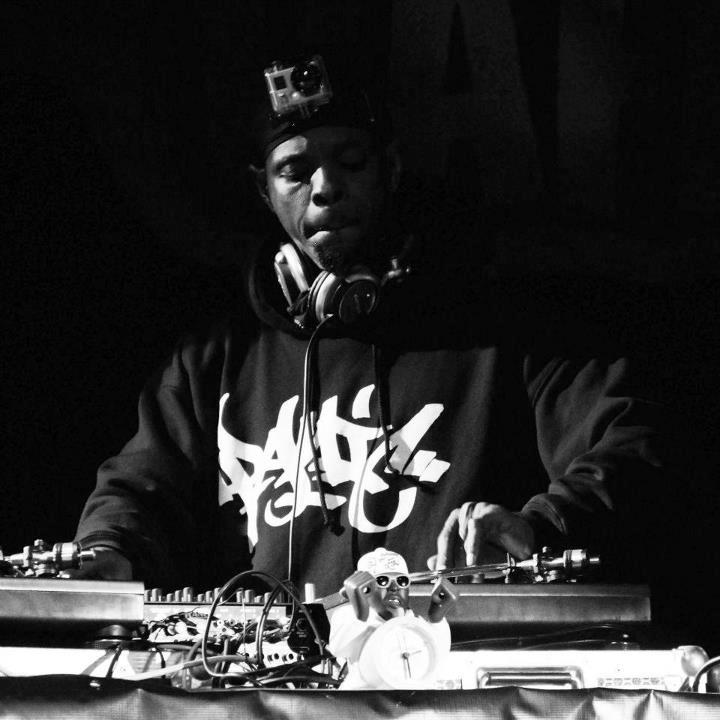 DJ Lord of Public Enemy in a Panic 39 hoodie cutting on turntables, black and white photo