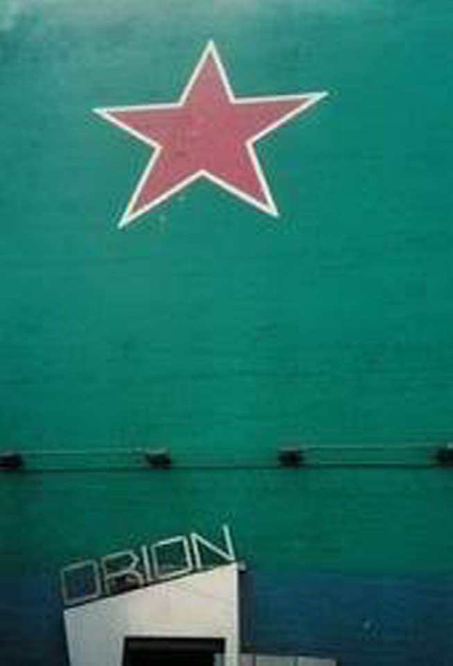The front of the Orion Theater at 740 S. Broadway, downtown Los Angeles, with the red star on the teal wall
