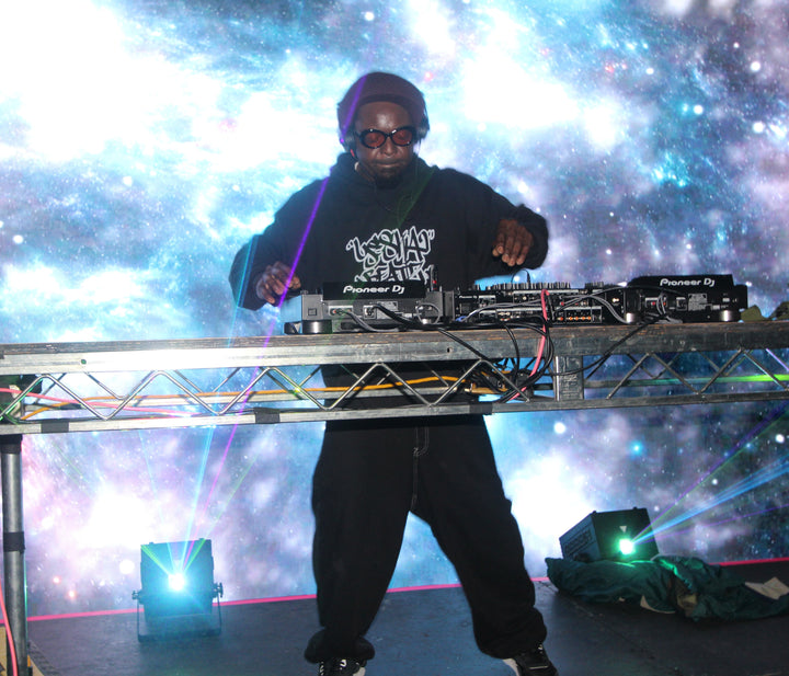 DJ on stage in front of a galaxy backdrop at Paws for a Cause, 9ThirtyLA, Los Angeles