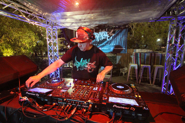 DJ mixing outdoors under a truss stage at Speaker Choke, 18 Bin, Las Vegas, April 2024